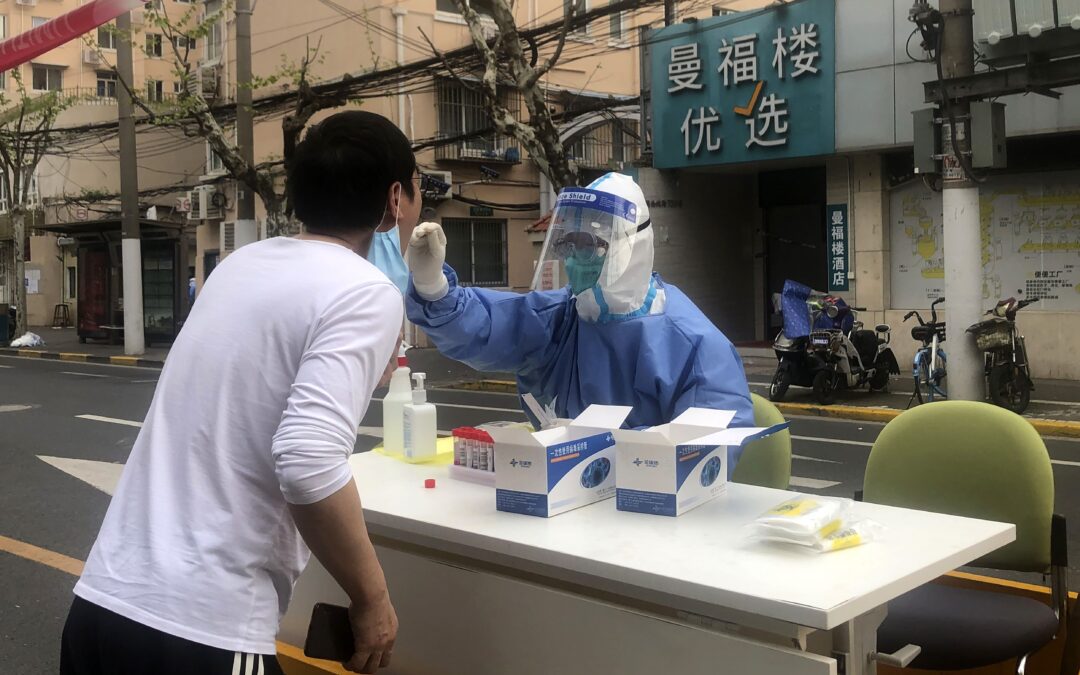Shanghai discharges thousands of patients, boosts supplies