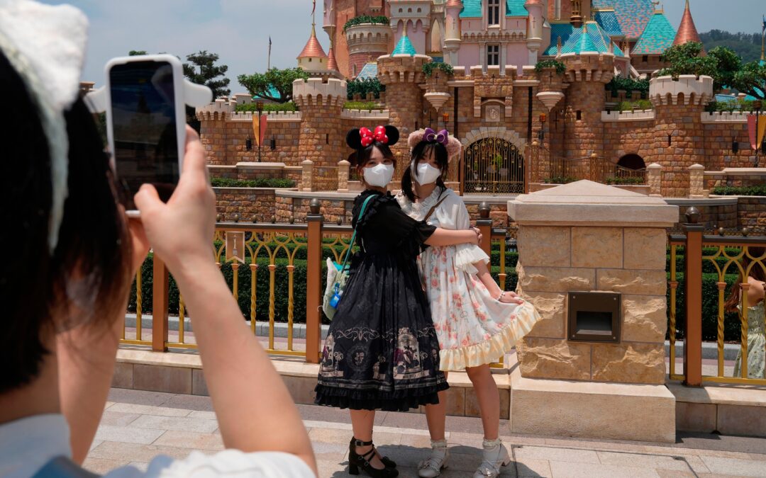 Hong Kong Disney opens as COVID eases; Shanghai deaths rise