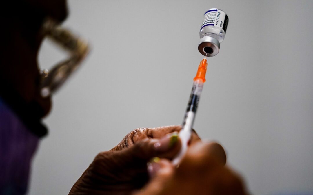 Pfizer says tweaked COVID-19 shots boost omicron protection