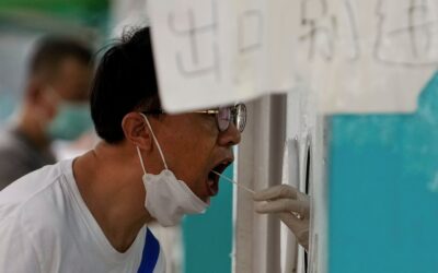 China finds more COVID cases after locking down beach resort