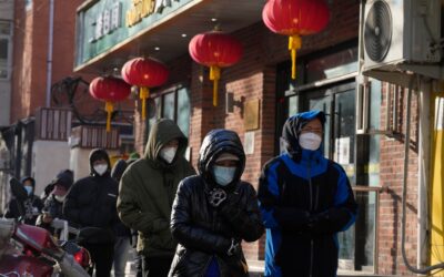 China reduces COVID-19 case number reporting as virus surges